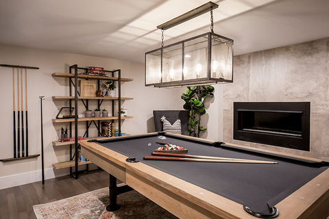 Down to Earth Projects | Castlefield Lane - game room open shelf cabinent concrete fireplace 