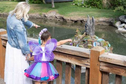 Woodland Fairy Festival - grandma and granddaughter at woodland fairies by the fairy island 