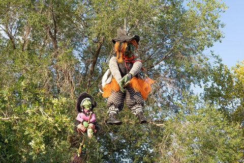 Gardner Village Witch Displays - witches racing down the gardner village paths 