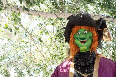 Gardner Village Witch Displays - witch under a tree 