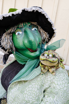 Gardner Village Witch Displays - witch with a frog on her shoulder 