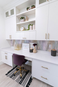 Down to Earth Projects | Kaysville Residence - work space with desk and purple chair 