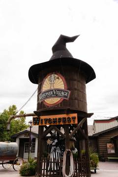 Gardner Village Witch Displays - water tower with giant witch hat and witches underneath 