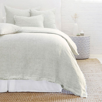 Logan Olive Duvet - light grey duvet on bed 