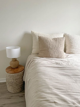 Boucle Pillows - Cream boucle pillows on bed 