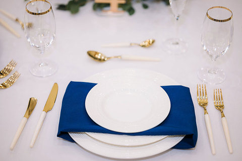 Weddings at The Gathering Place - white blue and gold table setting for a wedding 
