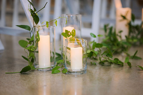 Weddings at The Gathering Place - candles and greenery at wedding  