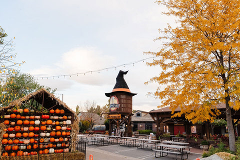 Gardner Village WitchFest - pumpkin house and water tower with a witch hat 