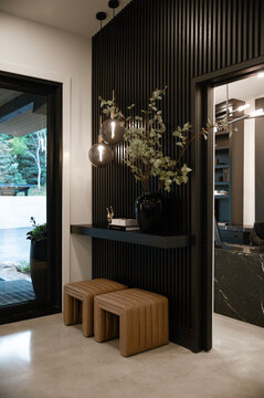 Down to Earth Projects | Park City Parade with Riverwood Interiors - entryway of park city home with black walls 