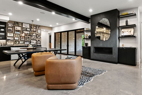 Down to Earth Projects | Park City Parade with Riverwood Interiors - basement game room in black with a vintage vibe 
