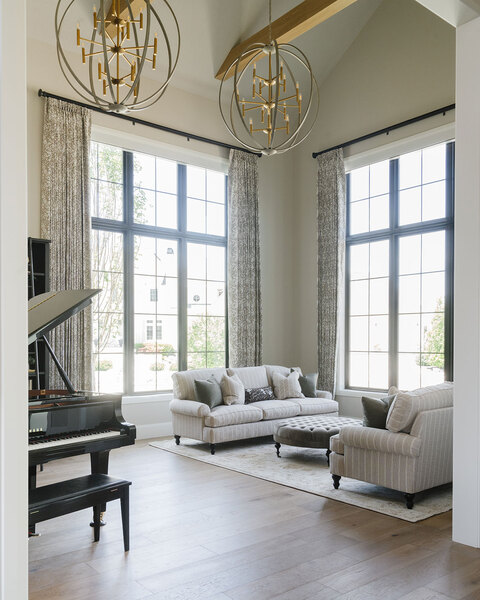 Down to Earth Projects | Utah Valley Parade at The Legacy at Meadow Ridge - Down to Earth Projects | Utah Valley Parade at The Legacy at Meadow Ridge - front sitting room with grand piano
