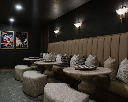 Down to Earth Projects | Utah Valley Parade at The Legacy at Meadow Ridge - home theater with tables and bench seating 