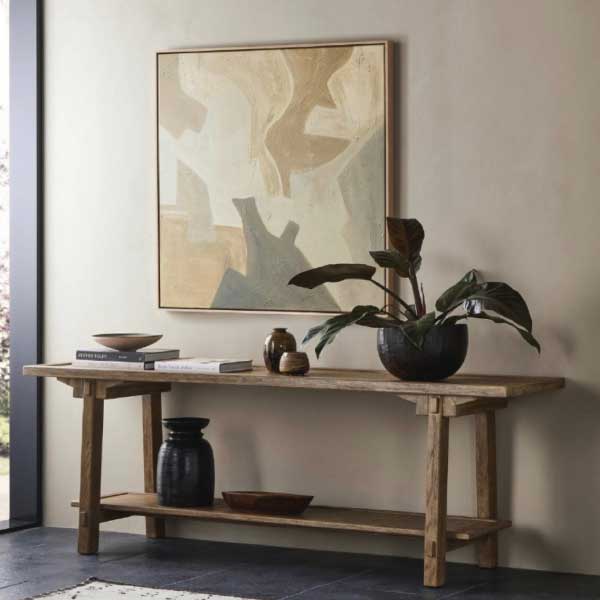 console table with art on wall