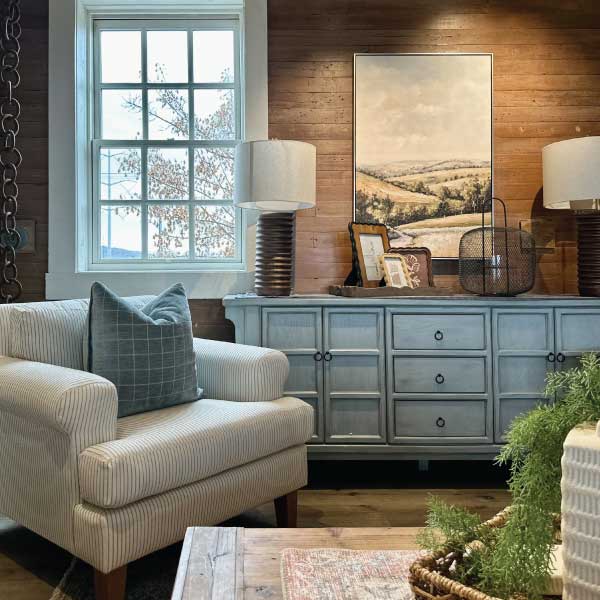 blue cabinet and cream chair at cf home