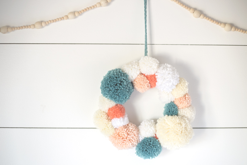 DIY yarn pom pom wreath