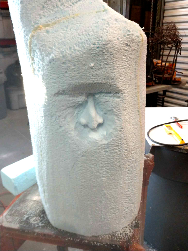 carving a face from foam
